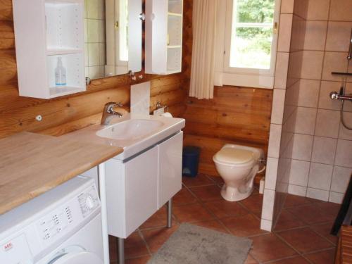 a bathroom with a sink and a toilet at Two-Bedroom Holiday home in Dannemare 1 in Dannemare