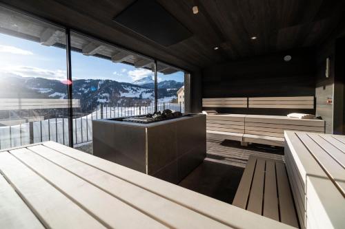 a kitchen with a view of a mountain at Hotel Plan Murin in La Valle
