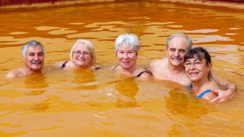 a group of four people in the water at Hotel Tusnad in Băile Tuşnad