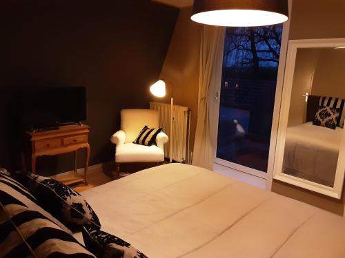 Кровать или кровати в номере Villa commune PoldersView