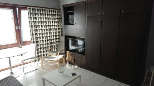 
A television and/or entertainment center at Studio Algarve
