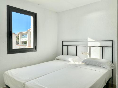 מיטה או מיטות בחדר ב-Apartamentos Stella Maris