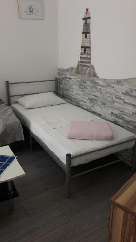 Postel nebo postele na pokoji v ubytování Apartmani Marić
