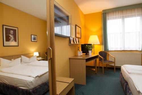 Voodi või voodid majutusasutuse Jembo Park Hotel toas