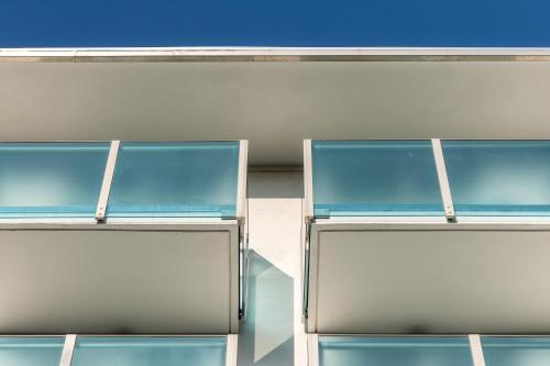 two empty glass shelves in a building at Hotel Katja in Bibione
