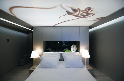 En eller flere senge i et værelse på The Vine Hotel
