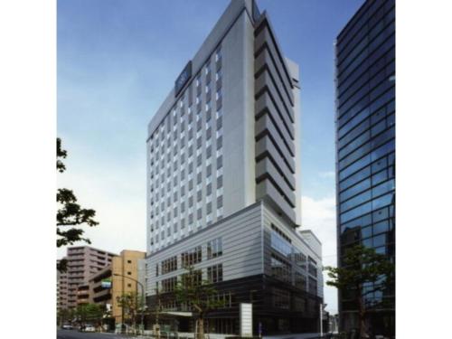 a rendering of a tall building in a city at R&B HOTEL HACHIOJI - Vacation STAY 13872v in Hachioji
