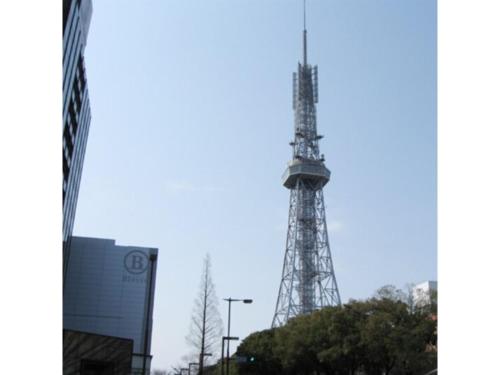 a transmission tower in the middle of a city at R&B HOTEL NAGOYA SAKAE HIGASHI - Vacation STAY 14030v in Nagoya