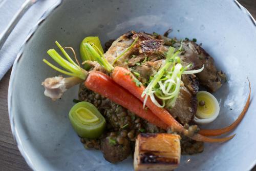 a plate of food with meat and vegetables at Origin Westminster a Wyndham Hotel in Westminster