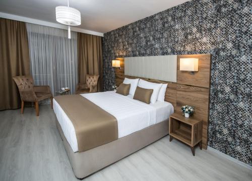 Letto o letti in una camera di White House Hotel