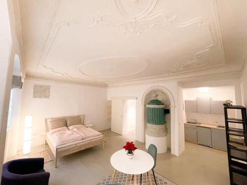 a living room with a couch and a table at Lauben Suite Old Town Bolzano in Bolzano