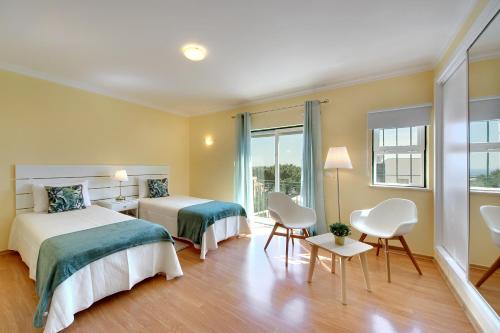 Ένα ή περισσότερα κρεβάτια σε δωμάτιο στο Eagle Eye Villa