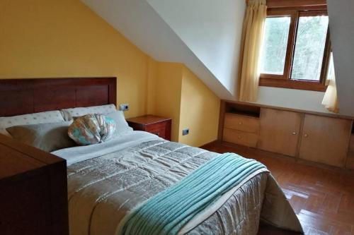 A bed or beds in a room at La casa de Aldán entre el mar y el bosque