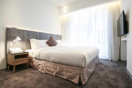 Postel nebo postele na pokoji v ubytování Dandy Hotel - Tianjin Branch