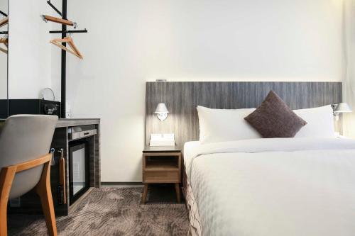 Postel nebo postele na pokoji v ubytování Dandy Hotel - Tianjin Branch