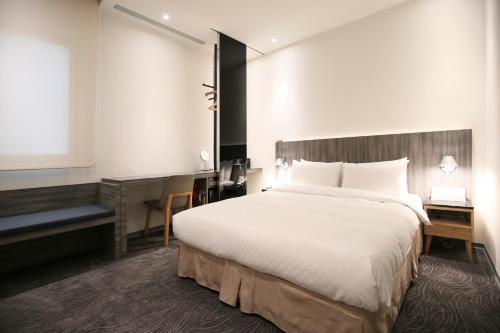 Postel nebo postele na pokoji v ubytování Dandy Hotel - Tianjin Branch