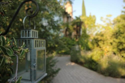 a small bird house sitting on a walkway at Casa Solis Monteprincipe in Boadilla del Monte
