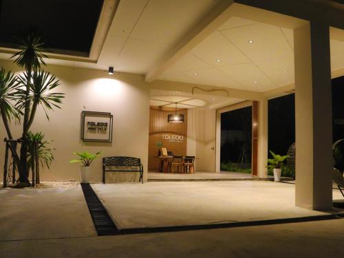a lobby of a house with a table and chairs at Toledo Pool Villa in Nakhon Si Thammarat