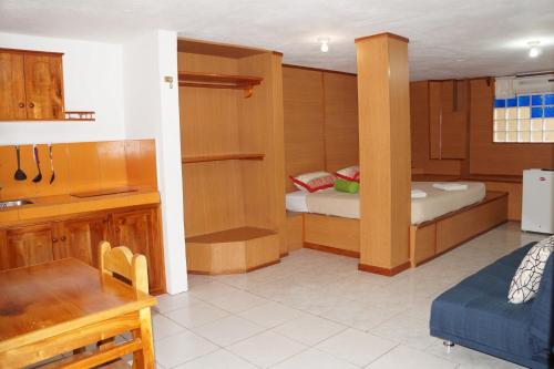 Cama o camas de una habitación en Galapagos Verde Azul