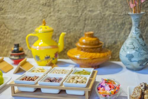 a table topped with bowls of different types of food at Arro Khampa By Zinc Journey Shangri-la in Shangri-La