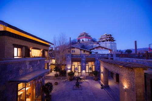 a view of a building at night with a building at Arro Khampa By Zinc Journey Shangri-la in Shangri-La