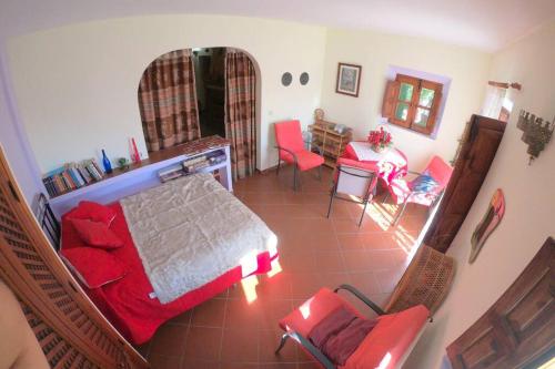 a bedroom with a bed and a table and chairs at Casa Pedregosa Bubión in Bubión