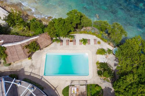 an aerial view of an island with a swimming pool at Granada Beach Resort - Adults Only in Boljoon