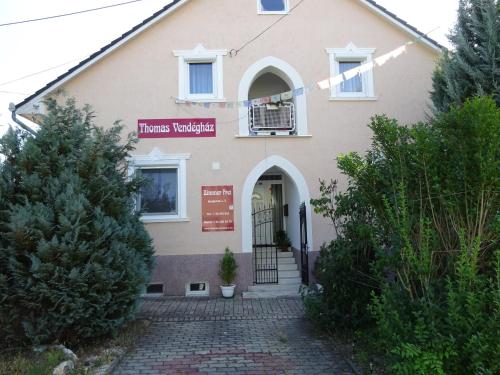 a house with a sign that reads miracles hospital at Deluxe szoba in Eger