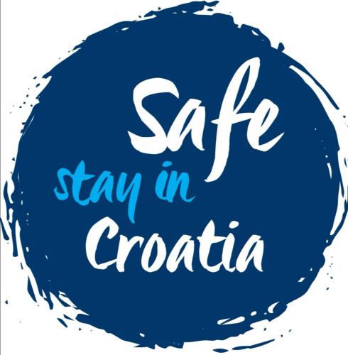 a blue circle with the words saff stay in croatia at Scuderia Split Rooms in Split