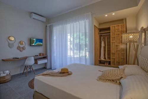 Katil atau katil-katil dalam bilik di Anemelia Luxury Apartments