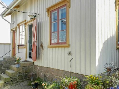 a house with a flag on the side of it at 6 person holiday home in LYSEKIL in Lysekil