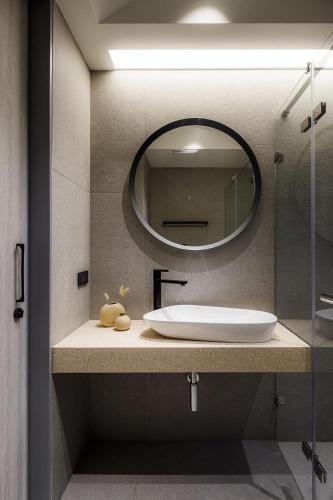 a bathroom with a sink and a mirror at Jiufen 35 in Jiufen