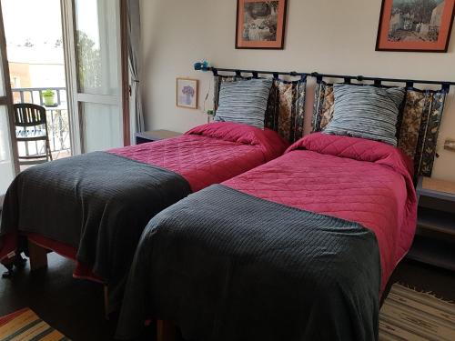 Een bed of bedden in een kamer bij Guesthouse La Rocca