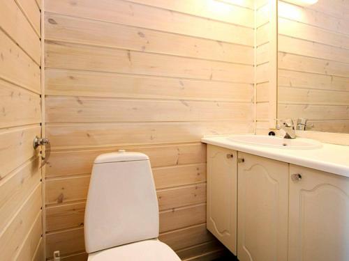 a bathroom with a toilet and a sink at 9 person holiday home in Farstad-By Traum in Farstad