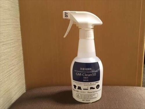 a bottle of calcium cleaner sitting on a table at Dormy Inn Hiroshima in Hiroshima