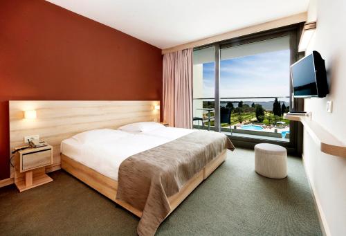 Postel nebo postele na pokoji v ubytování Hotel Materada Plava Laguna