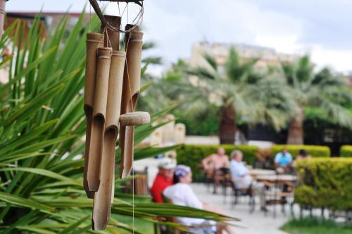 a group of baseball bats hanging from a string at Camyuva Beach Hotel in Kemer