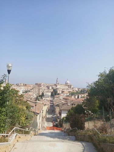 an empty street in a town with buildings at La casa sul tetto, Room's & Glamping in Recanati