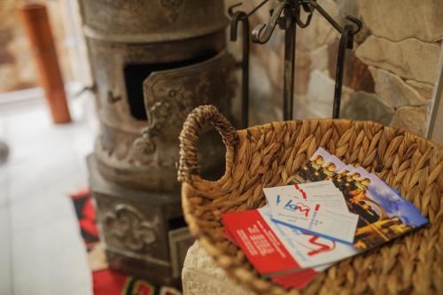 a basket with cards in it next to a fireplace at Studio Apartments KIM - Dilberovic in Mostar
