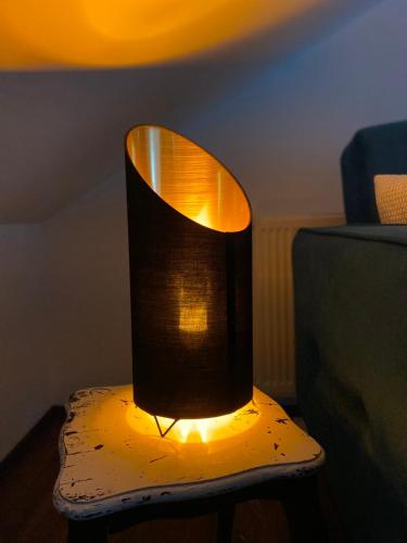 a lamp sitting on top of a table at APARTMAN PAVIĆ in Vinkovci