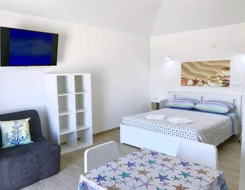 Case Vacanze "Bianco Mare" tesisinde bir odada yatak veya yataklar