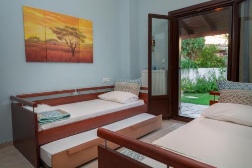 A bed or beds in a room at Villa Begonia by the sea