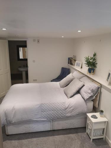 Ένα ή περισσότερα κρεβάτια σε δωμάτιο στο High gables Apartment 1