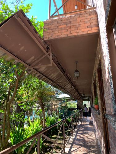 awning over a walkway on a building at Stone Cabins Boquete in Boquete