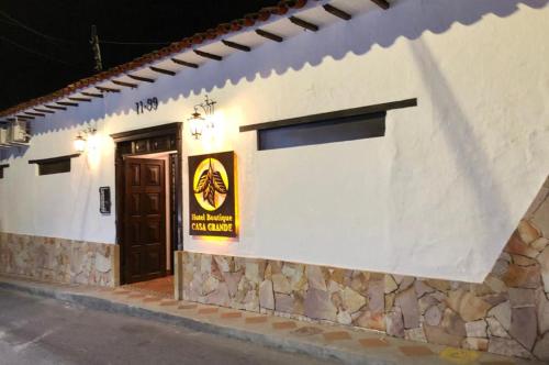 a building with a door and a sign on it at Hotel Boutique Casa Grande in Piedecuesta