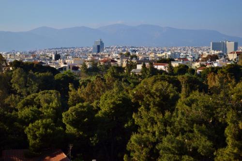 a view of a city with trees and buildings at Acropol Hotel in Athens
