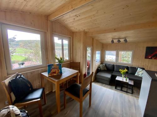 a living room with a couch and a table at Glückshütte in Unterwellenborn
