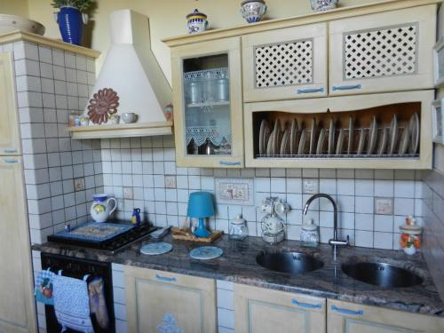 a kitchen with a sink and a counter top at PietraMilia in Terricciola