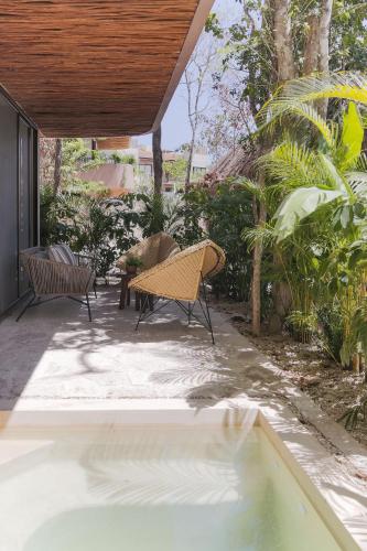 Um jardim em Zereno Tulum Beach Club Access