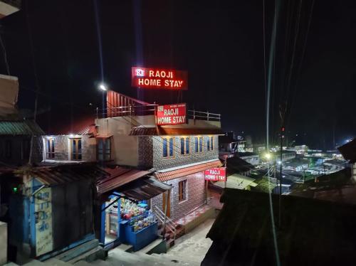 a building with a sign that reads no return home stay at RAOJI Home Stay in Vālpārai